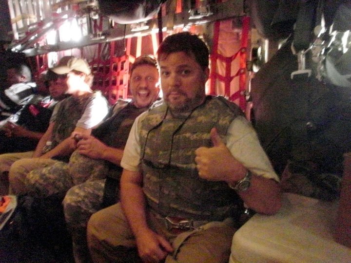 Michael Samstag in body armor aboard a military transport plane while filming in Iraq